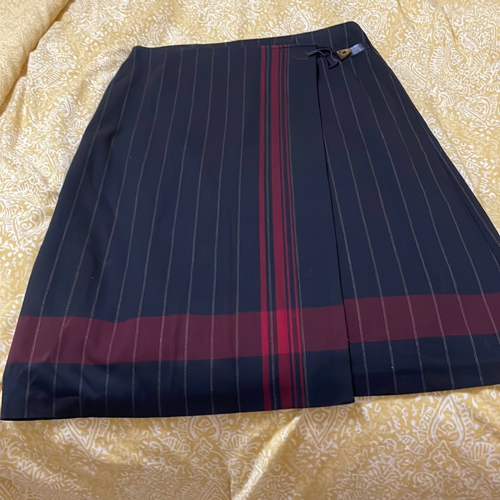 Requirement skirt size 18 black with white stripes deep red . Wrap around look.
